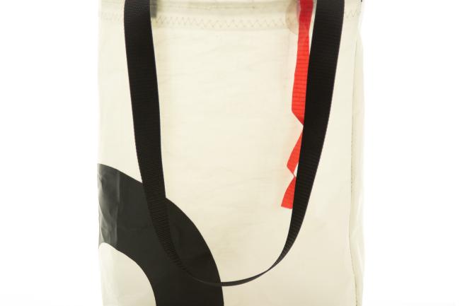 A red, white and black tote bag made of used sailcloth, by Ray McVicker