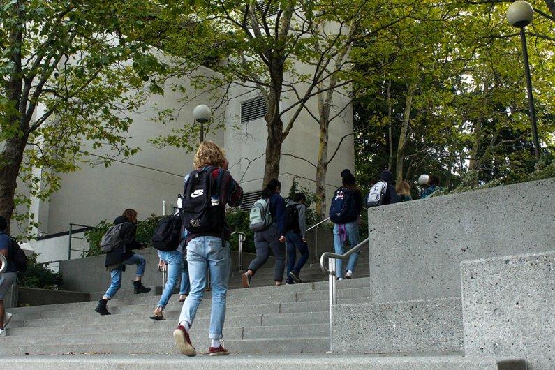Students walking up the steps from south campus to north campus