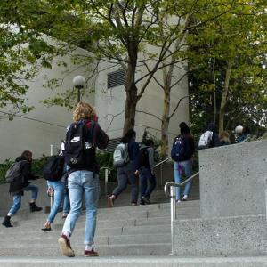Students walking up the steps from south campus to north campus